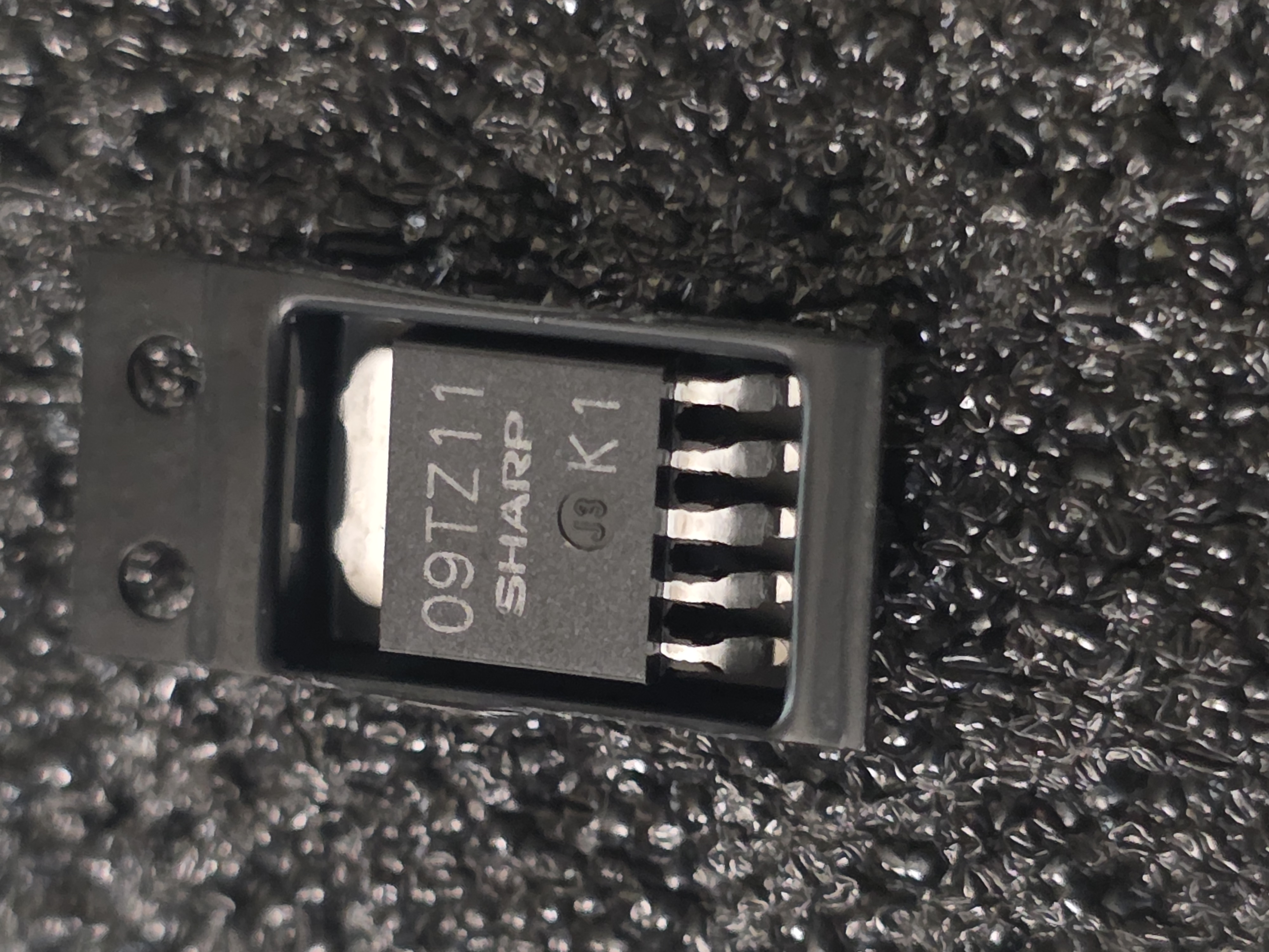 Sharp PQ09TZ1U / PQ09TZ11 9V Voltage Regulator IC — SMD TO-252-5 / SC-63  Description: Sharp low power-loss fixed 9V voltage regulator IC used in electronic equipment, radio boards, control circuits, and power-supply sections. Parts may be marked 09TZ11 o